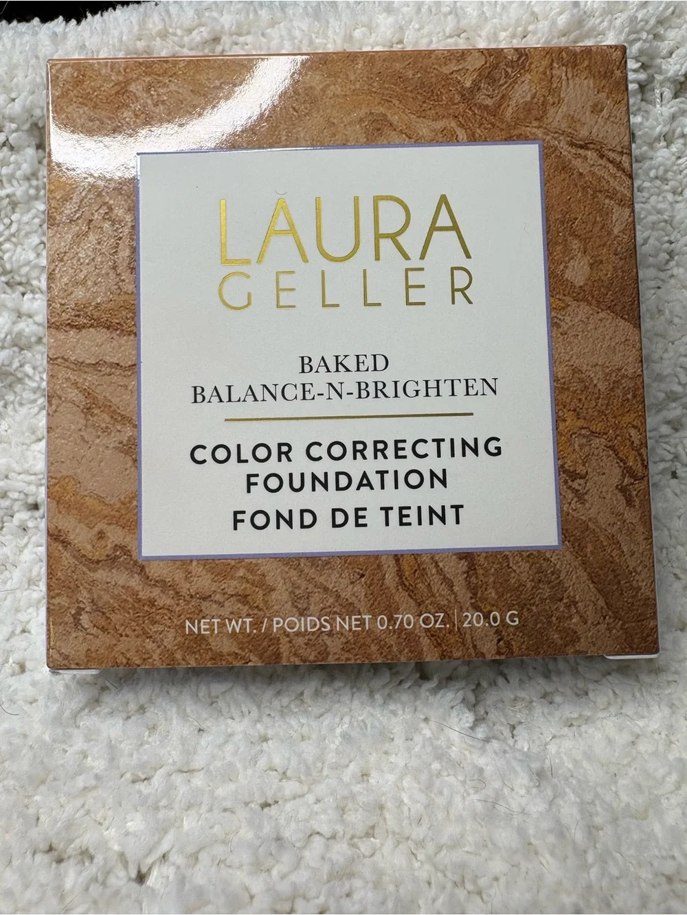 Laura Geller marbled baked face powder in brown and gold tones